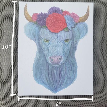Watercolor illustration of a blue highland cow with brown horns adorned with colorful flowers.